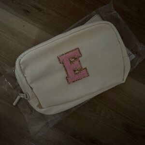 Cream with pink E belt bag, NWT